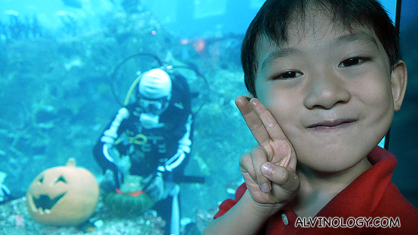 Asher posing by a skeleton diver 