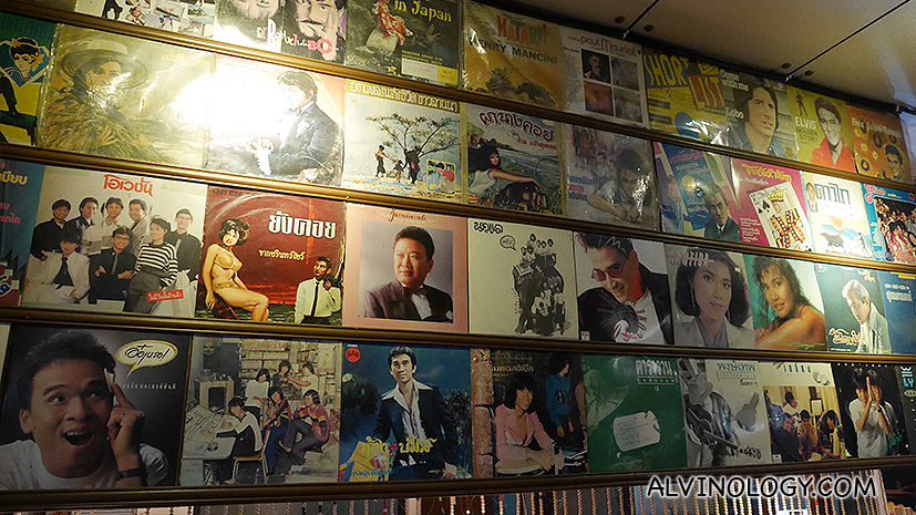 Vinyl record covers adorned the wall