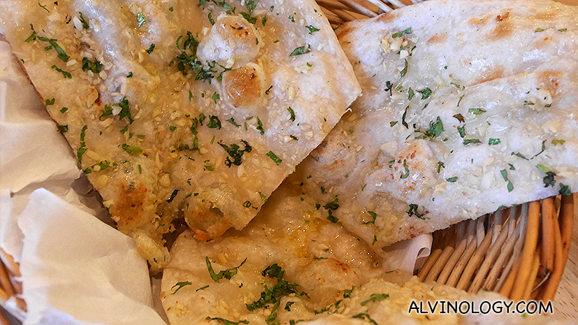 Garlic Naan (S$3) - Bread made from #nely milled wheat $our. Cooked in tandoor with chopped garlic