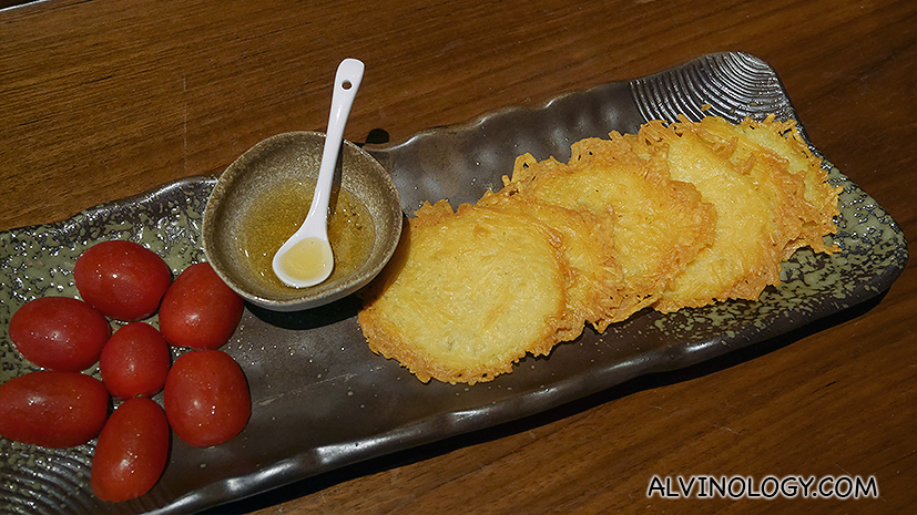 Fried parmesan cheese with tomato and honey (S$10)
